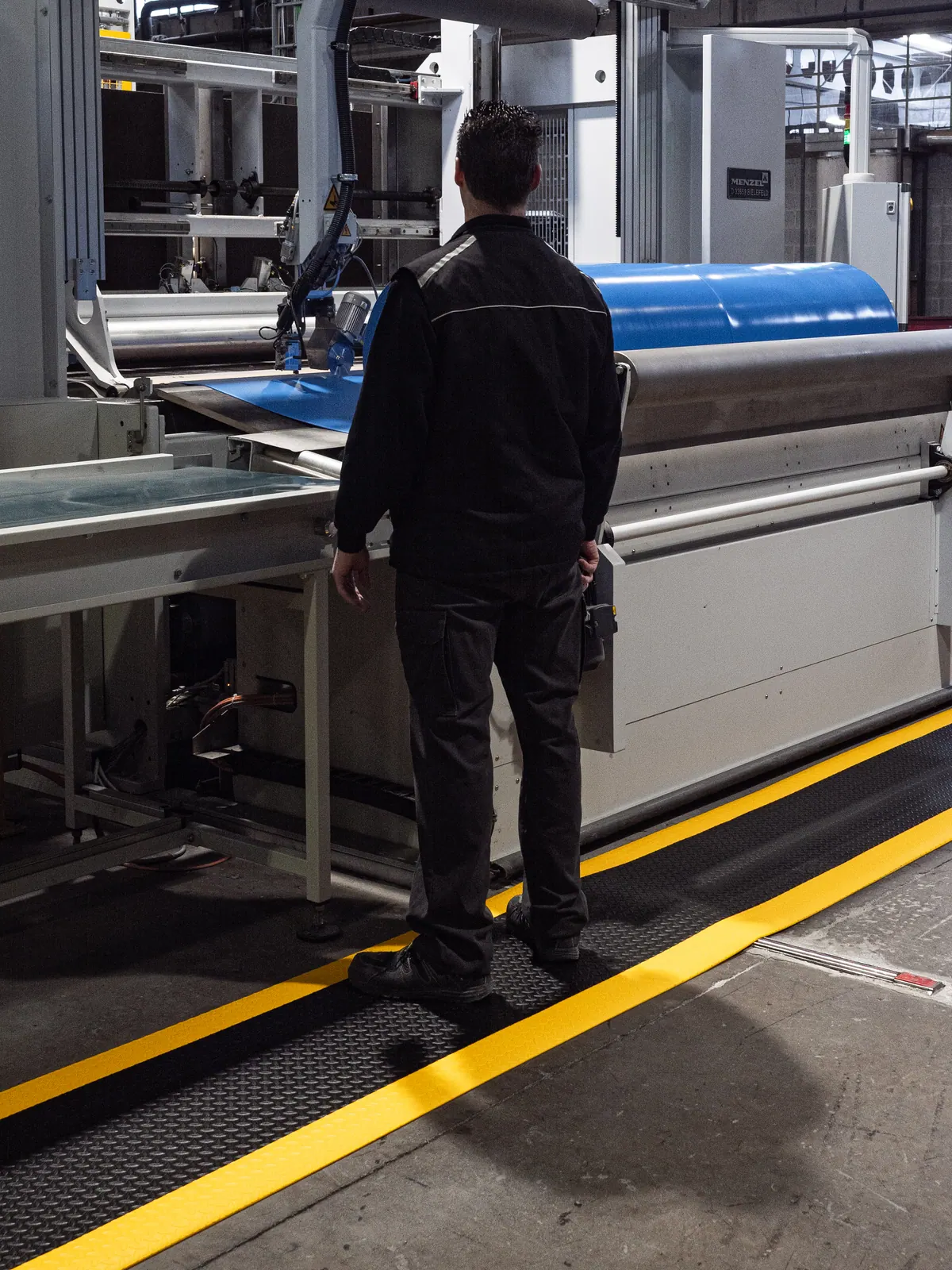 Maximum Matting M2 Series anti-fatigue mat in use at a production workstation