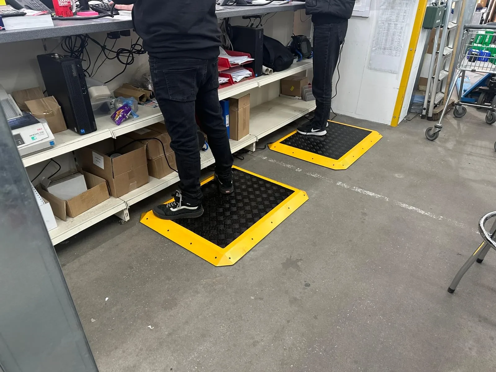 M-Heat heated mats in use at a packing station